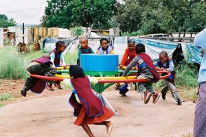 It doesn't even make sense as a toy. The fun part of carousels is the coasting, not the wind up